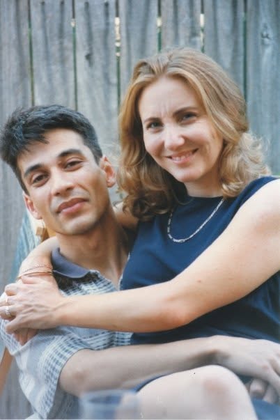 Anne in 2009, smiling with her arms around her partner